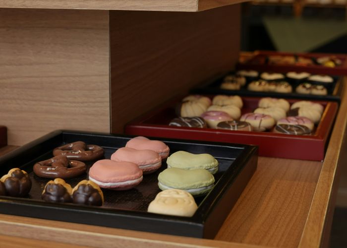 A selection of Japanese snacks and sweets served at a bakery counter.